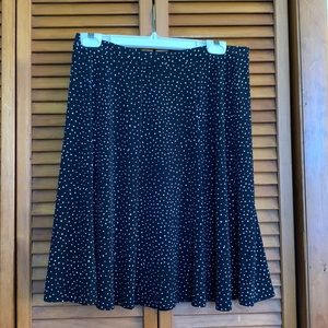 Mid length flowy black skirt with white dots